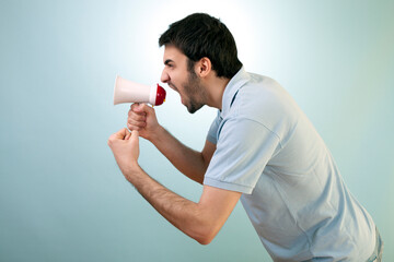 Young Man is Screaming Over Megaphone