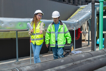 Engineer under checking the industry chilled water fan coil unit air conditioner is water cooling...