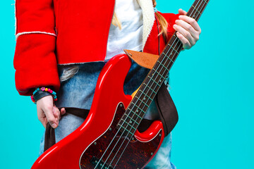 Musical Ideas. Closeup of Hands of Caucasian Guitar Player With Belt of Bass Guitar Posing In...