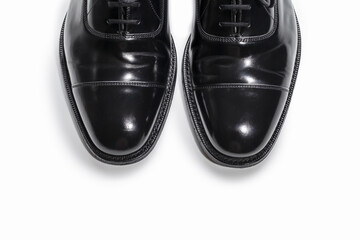 Footwear Concept. Closeup of Pair of Stylish Classic Formal Male Stylish Black Polished Oxford Leather Laced Shoes Placed Together Over White.