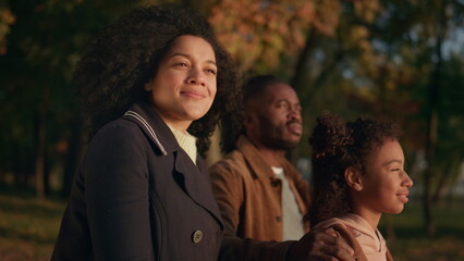 Couple kid watching sunset in autumn park together portrait. Leisure time garden