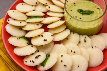 Mini idli is the smaller version of soft and spongy round shaped steamed regular rice idli, also known as button and cocktail idly