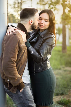 Beautiful couple in love on romantic dating, sensual relationship and desire of lovers, young man and woman having fun together outdoors, happy family life and candid lifestyle, vertical image