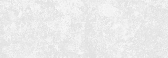 pastel white stucco wall with cracks and peeling paint flakes