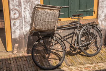 Fototapeta na wymiar Enkhuizen, Netherlands. Old-fashioned means of transport from the last century at the Zuiderzee Museum in Enkhuizen.