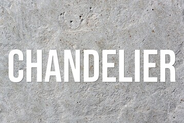 CHANDELIER - word on concrete background. Cement floor, wall.