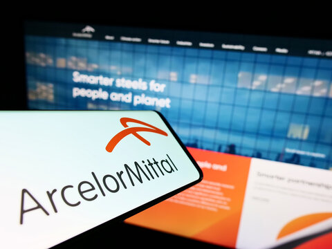 Stuttgart, Germany - 06-12-2022: Smartphone with logo of steel company company ArcelorMittal S.A. on screen in front of business website. Focus on right of phone display.