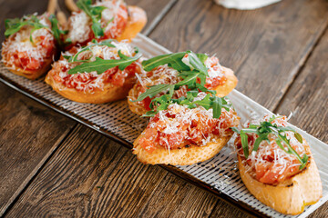 Closeup on portion of gourmet bruschettas appetizer