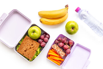 School lunch boxes filled with fruits and vegetables. Healthy meal