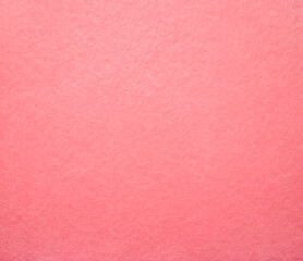 Pink felt fabric close-up. Abstract background. The texture of the fibers. Velvet surface.