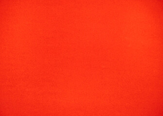 Red felt fabric close-up. Abstract background. The texture of the fibers. Velvet surface.