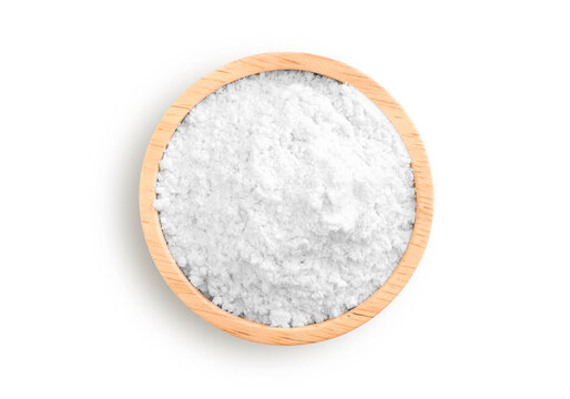 Calcium hydroxide powder (Deydrated lime) in wooden bowl isolated on white background. Top view. Flat lay.