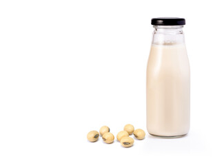 bottle of soy milk with soybean on white