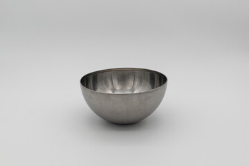 metal salad bowl on white background.