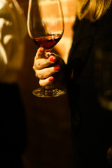 person with glass of wine