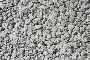 Texture of a cement block made of small pebbles