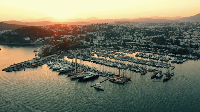 Aerial drone view of sea, harbor, boats and city architecture. Majestic view of resort town of Bodrum in Turkey.