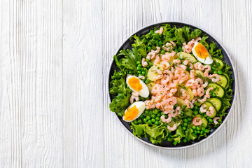 pink cocktail shrimps salad with veggies and eggs