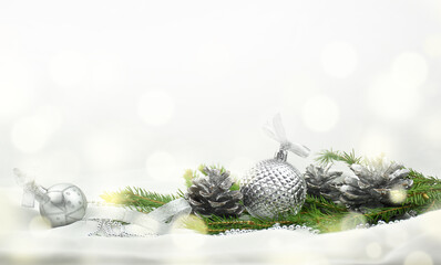 Background for New Year and Christmas theme with silver balls and fir branches. Template for the New Year greeting card or banner.