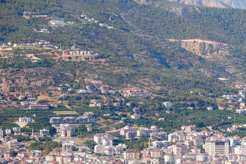Fototapeta premium View of the roofs and the city of Alanya in Turkey from the height of the mountains