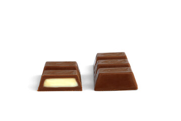Chocolate pieces with milk filling isolated on white background.