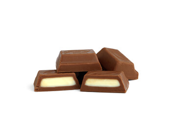 Chocolate pieces with milk filling isolated on white background.