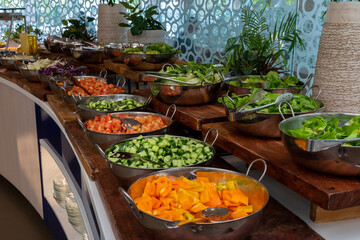 Typical Israeli breakfast buffet at any hotel.  Salad bar with tomatoes, cucumbers, peppers and various kinds of greens and other vegetables. Very healthy and what  most Israelis love for breakfast.
