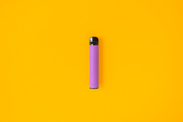 Layout of colorful disposable electronic cigarettes with shadows on a yellow background. The concept of modern smoking, vaping and nicotine. Top view