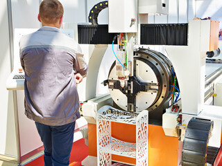Man worker and laser cutting machines for cutting metal tubes industry