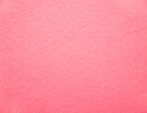Pink felt fabric close-up. Abstract background. The texture of the fibers. Velvet surface.