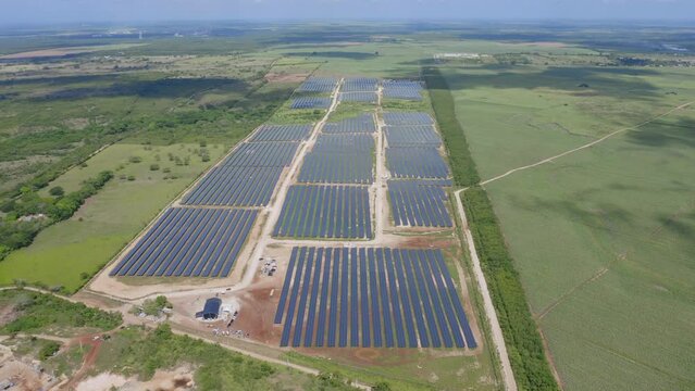 High angle aerial drone pov of El Soco solar photovoltaic park of San Pedro De Macoris in Dominican Republic