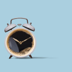 Alarm clock and coffee concept isolated on pastel blue background. Alarm clock as coffee cup over...