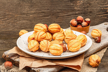 Cookies in the shape of walnuts with condensed milk cream filling.Delicious shortbread sandwiches