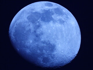 full Moon close up with dark sky in the background 