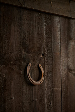 old horseshoe on wooden background