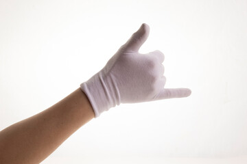 Hands gesticulating in white textile gloves on a white background