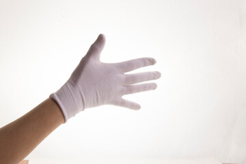 Hands gesticulating in white textile gloves on a white background