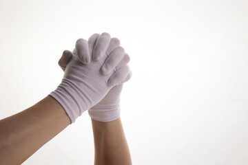 Hands gesticulating in white textile gloves on a white background
