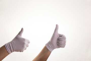 Hands gesticulating in white textile gloves on a white background