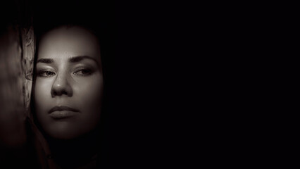 Portrait of a young woman in the shade close up