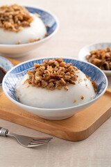 Taiwanese savory rice pudding Wa gui with chopped dried radish and soy sauce