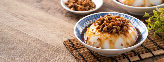 Taiwanese savory rice pudding Wa gui with chopped dried radish and soy sauce