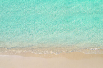 Fototapeta na wymiar Top view of tropical Seychelles sand beach. Blue, turquoise transparent water surface of ocean, sea, lagoon. Horizontal background. Aerial, drone view
