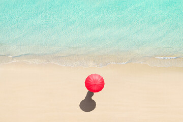 Top view of woman with red summer umbrella walking tropical Seychelles sand beach. Blue, turquoise...