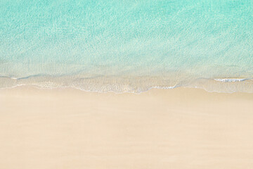 Top view of tropical Seychelles sand beach. Blue, turquoise transparent water surface of ocean, sea, lagoon. Horizontal background. Aerial, drone view