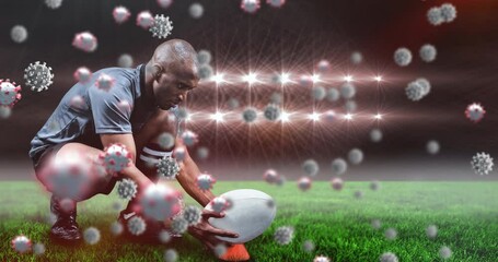 Animation of virus cells over biracial male rugby player at stadium - Powered by Adobe