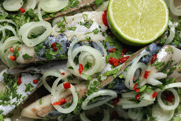 Marinated fillet of mackerel with onions, herbs, lime and chilli. Mediterranean food, appetiser, seafood