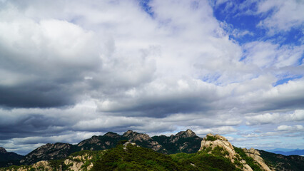 The grandeur of the mountain peaks and clouds of Bukhansan Mountain