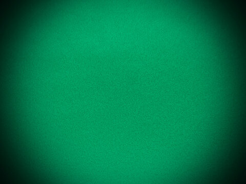 Felt green soft rough textile material background texture close up,poker table,tennis ball,table cloth. Empty green fabric background..
