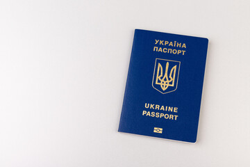 Ukrainian passport with a golden trident symbol on light background. Biometric Ukraine passport id...